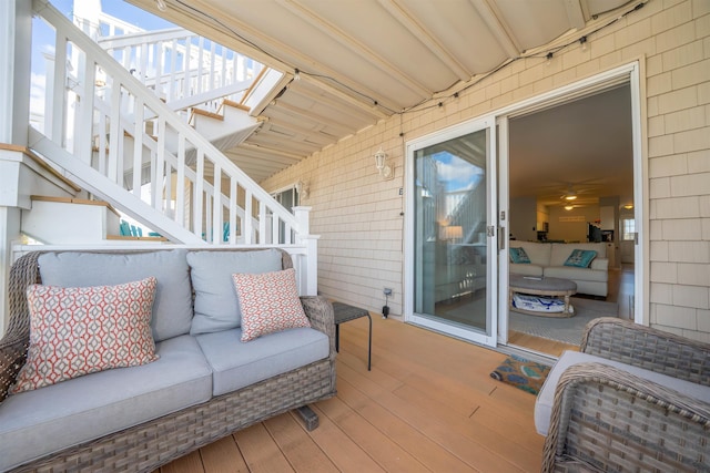 wooden deck with outdoor lounge area