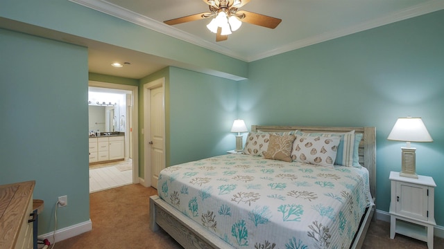 carpeted bedroom with ceiling fan, ensuite bath, and ornamental molding