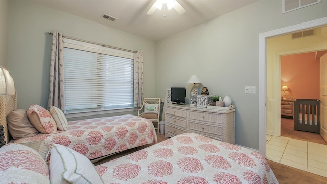 bedroom with light tile patterned flooring and ceiling fan