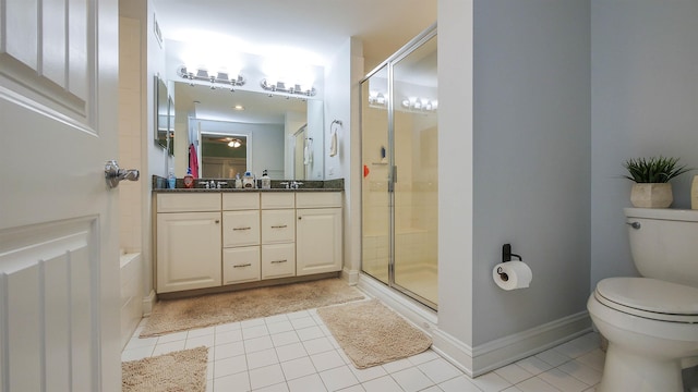 full bathroom featuring vanity, tile patterned flooring, shower with separate bathtub, and toilet