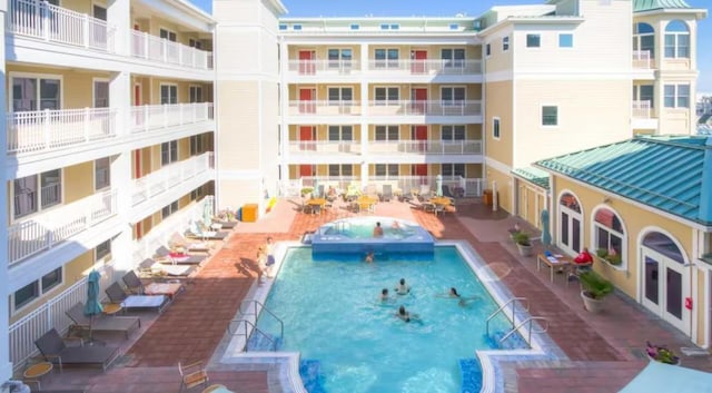 view of swimming pool with a patio area