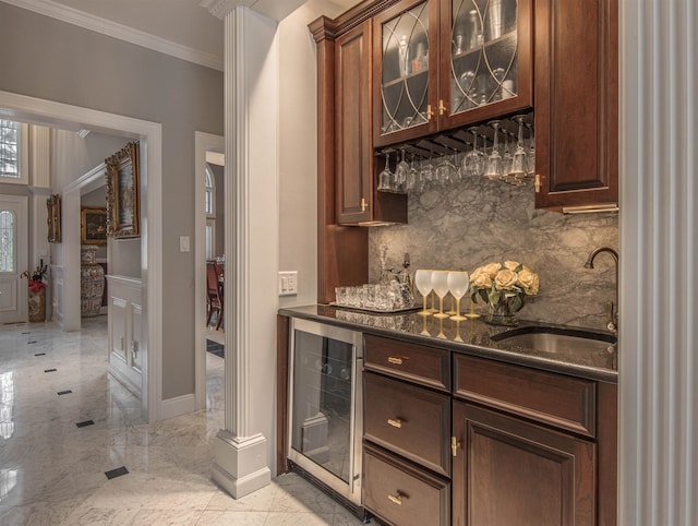 bar featuring tasteful backsplash, dark stone counters, ornamental molding, sink, and wine cooler