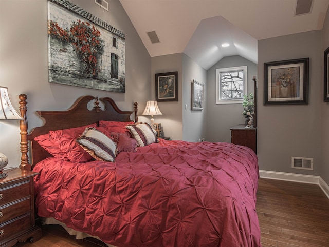 bedroom with dark hardwood / wood-style floors and vaulted ceiling