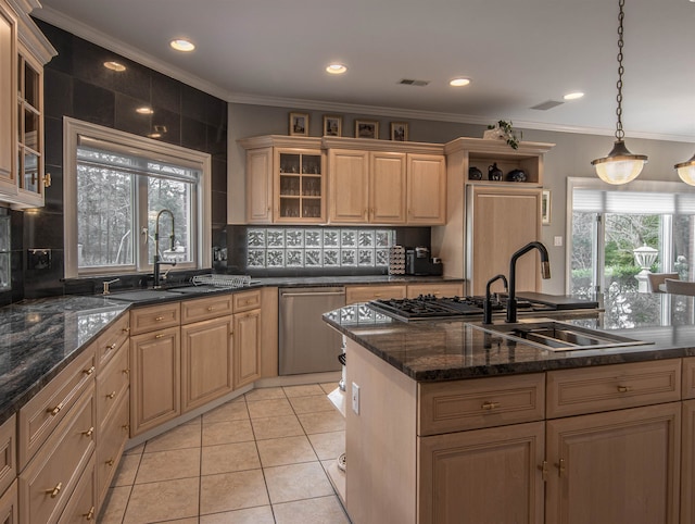 kitchen featuring stainless steel dishwasher, decorative light fixtures, light tile patterned flooring, and sink