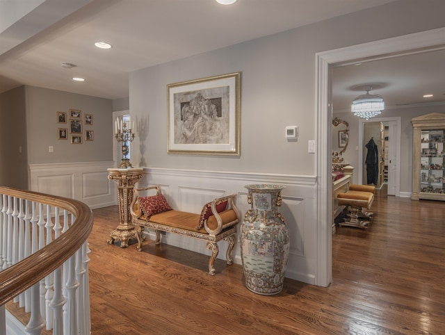 corridor with dark hardwood / wood-style flooring