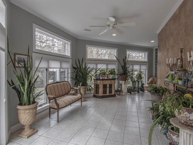 sunroom featuring ceiling fan