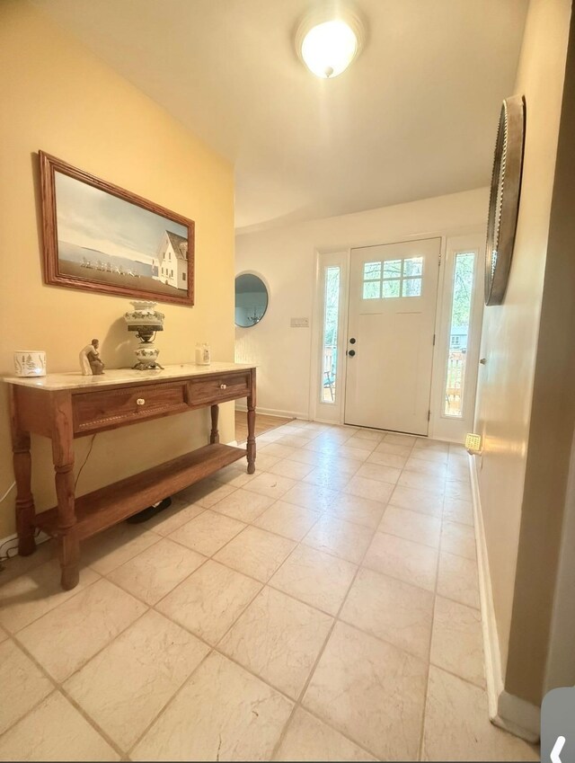 entrance foyer featuring baseboards