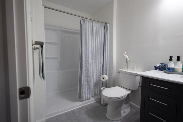 bathroom with toilet, tile patterned floors, and vanity