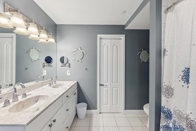 415 E Heather Rd Unit 202, Wildwood Crest, NJ 08260 - full bath with tile patterned floors, double vanity, toilet, baseboards, and a shower with shower curtain