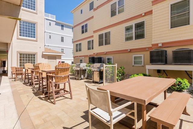 415 E Heather Rd Unit 202, Wildwood Crest, NJ 08260 - view of patio / terrace featuring outdoor dining area, a grill, and central air condition unit
