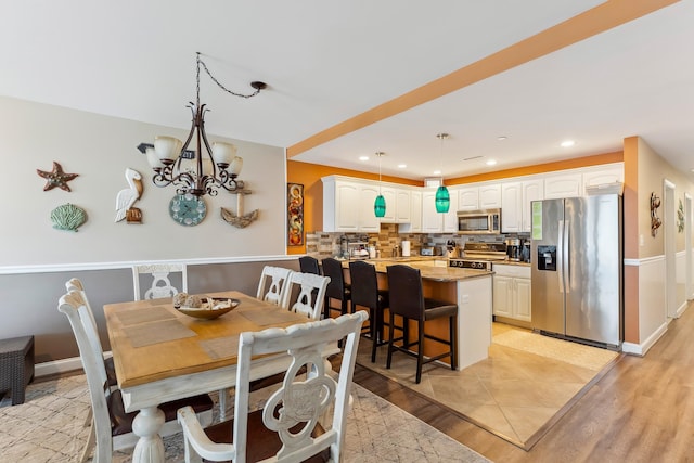 415 E Heather Rd Unit 202, Wildwood Crest, NJ 08260 - dining room featuring recessed lighting, light wood-type flooring, and a chandelier