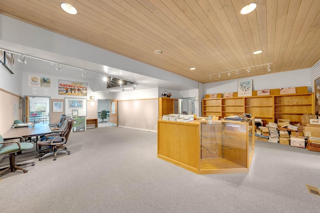 office space with rail lighting, wood ceiling, and light colored carpet