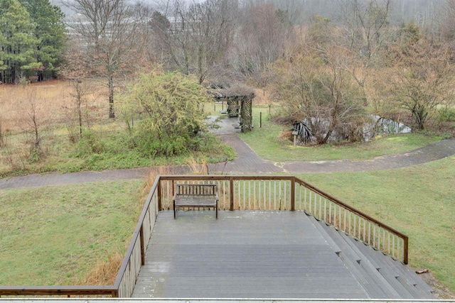 wooden terrace with a yard