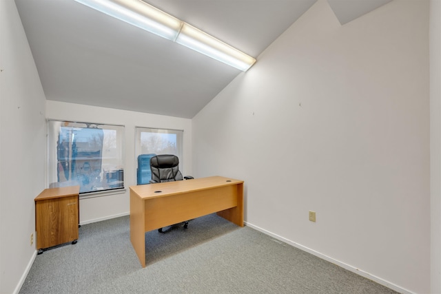 office featuring light colored carpet and vaulted ceiling