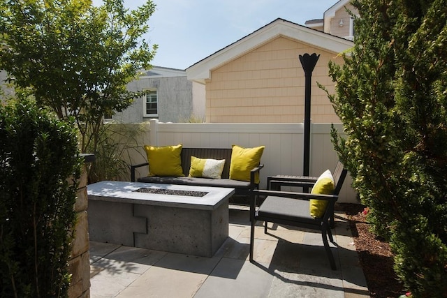 view of patio with an outdoor fire pit