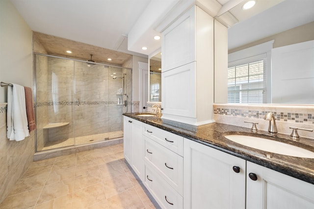 bathroom with tile patterned flooring, vanity, and a shower with shower door