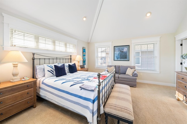 bedroom featuring lofted ceiling with beams and light carpet