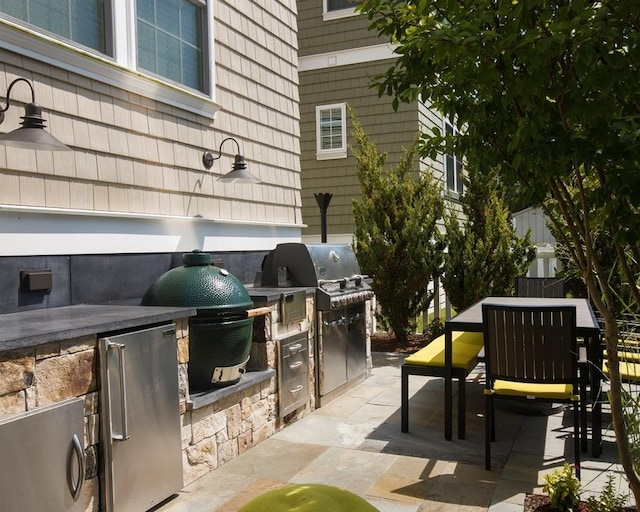 view of patio / terrace featuring grilling area and exterior kitchen