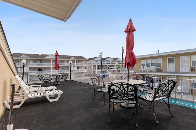 view of patio featuring a balcony