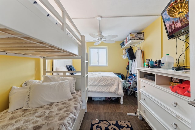 bedroom featuring ceiling fan and dark wood-type flooring