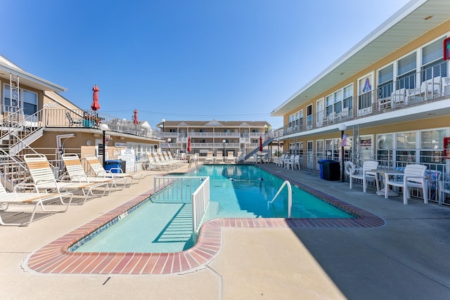 view of swimming pool featuring a patio