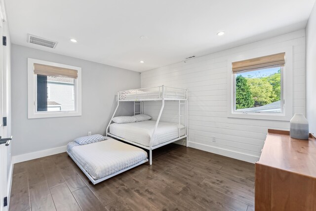 401 Fern Rd, Cape May Beach, NJ 08251 - bedroom featuring baseboards, dark wood-style floors, recessed lighting, and wood walls