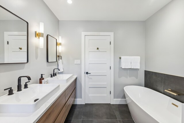 401 Fern Rd, Cape May Beach, NJ 08251 - full bath featuring a freestanding bath, double vanity, baseboards, recessed lighting, and tile patterned floors