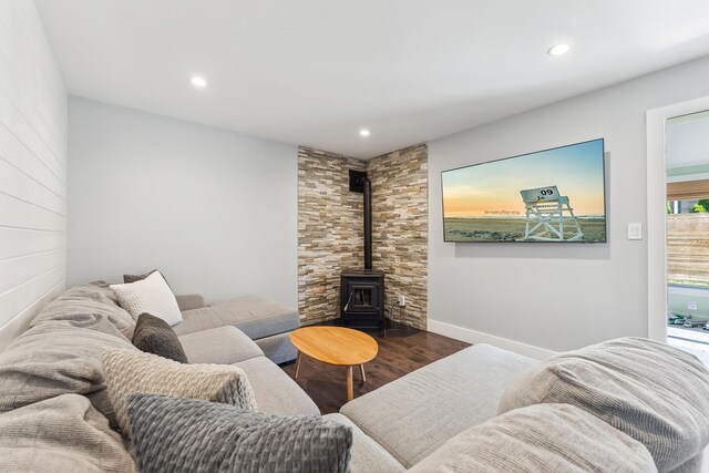 401 Fern Rd, Cape May Beach, NJ 08251 - living area featuring wood finished floors, a wood stove, recessed lighting, and baseboards