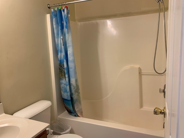 full bathroom with toilet, shower / bath combo with shower curtain, and sink