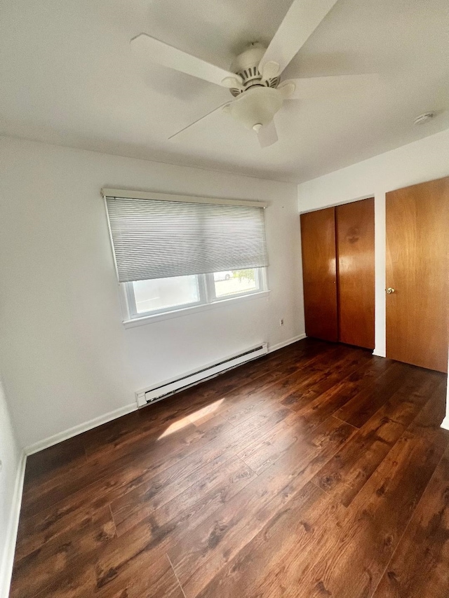 106 Cedardale Ave, Villas, NJ 08251 - unfurnished bedroom featuring a baseboard radiator, hardwood / wood-style flooring, a ceiling fan, and two closets