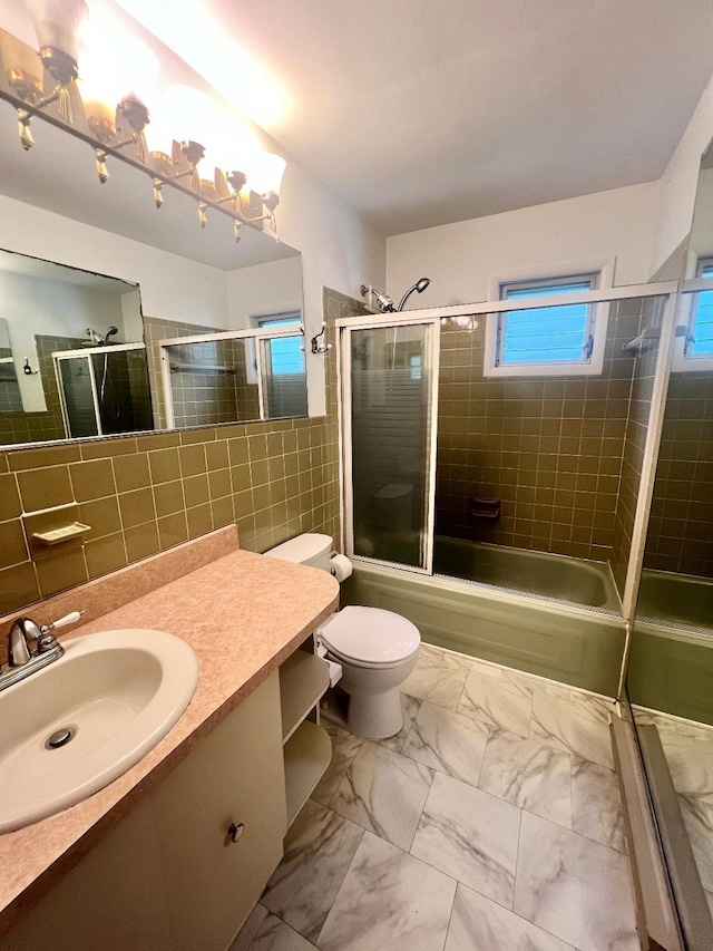 106 Cedardale Ave, Villas, NJ 08251 - bathroom featuring tile walls, marble finish floors, vanity, and combined bath / shower with glass door