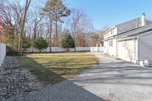 view of yard with a fenced backyard