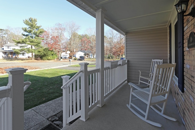 view of patio / terrace featuring a residential view and covered porch