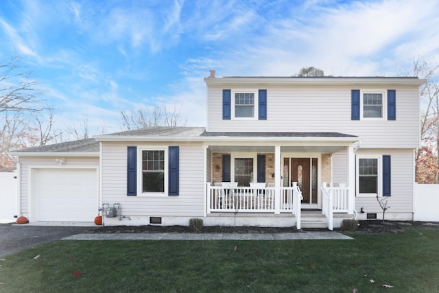 view of front of home with an attached garage, covered porch, driveway, crawl space, and a front yard