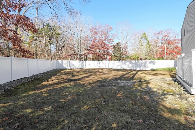 view of yard with a fenced backyard