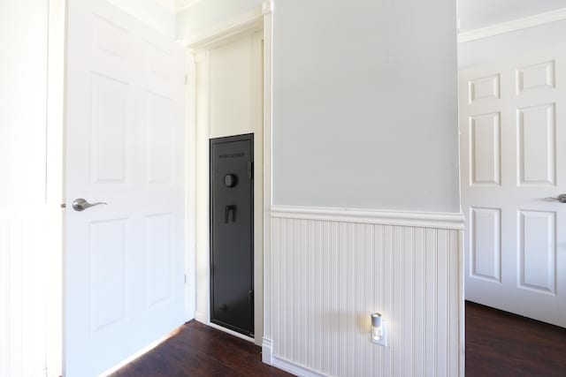 interior space with a wainscoted wall and wood finished floors