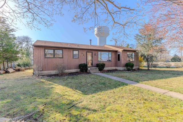 ranch-style home with a front yard