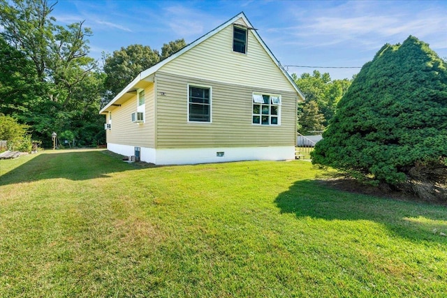 view of property exterior with a yard and cooling unit