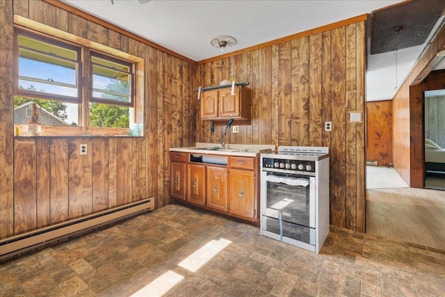 kitchen with wooden walls, a baseboard heating unit, and range