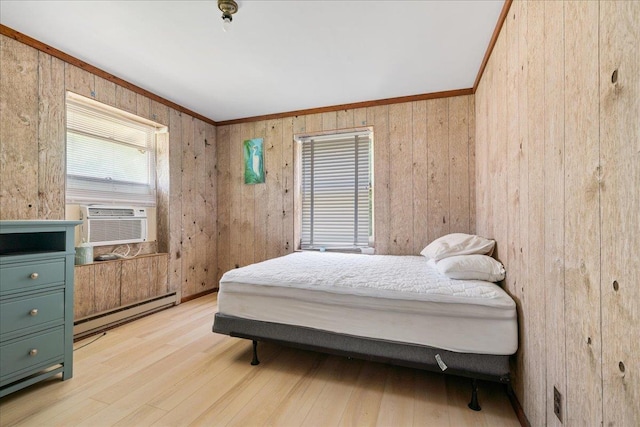 bedroom featuring wooden walls, crown molding, cooling unit, and a baseboard heating unit