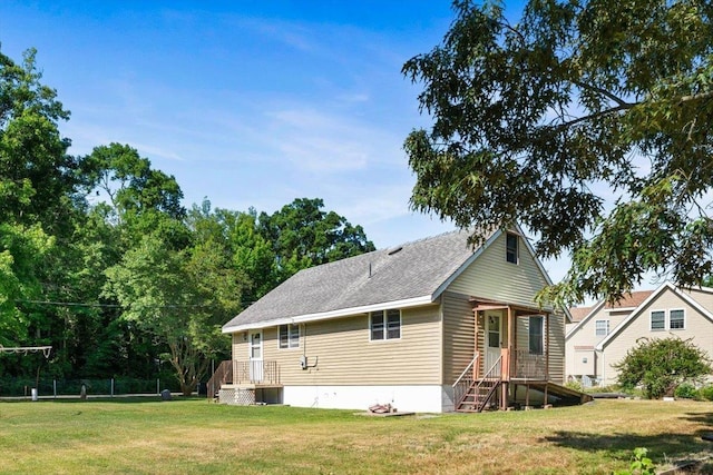 view of property exterior with a yard and central air condition unit