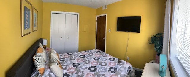 bedroom featuring a closet and a textured ceiling