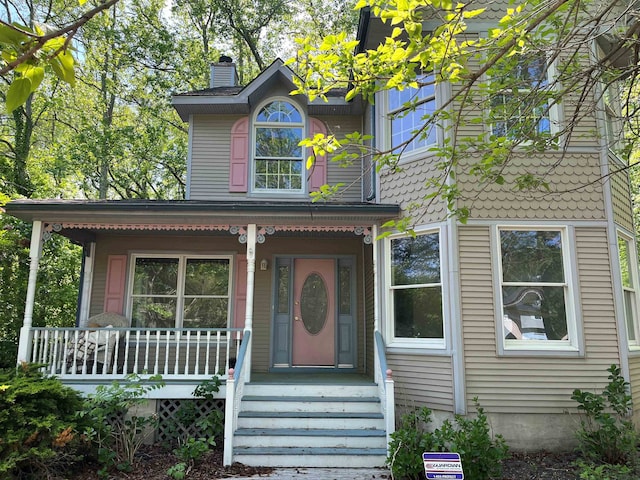 48 Secluded Ln, Rio Grande, NJ 08242 - view of front of property featuring a porch and a chimney