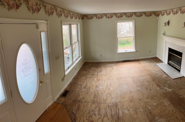 48 Secluded Ln, Rio Grande, NJ 08242 - entryway featuring healthy amount of natural light, baseboards, and a tiled fireplace