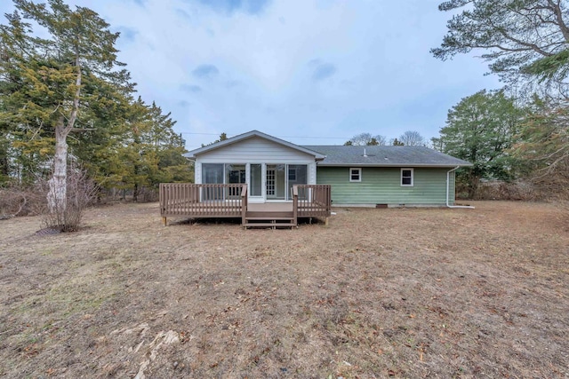 rear view of house with a wooden deck