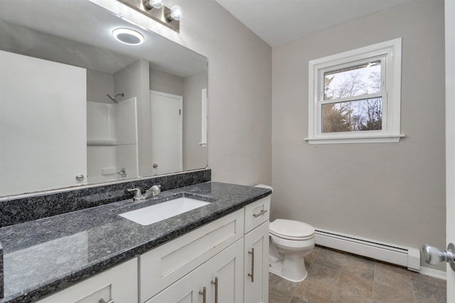 bathroom with vanity, a shower, toilet, and baseboard heating