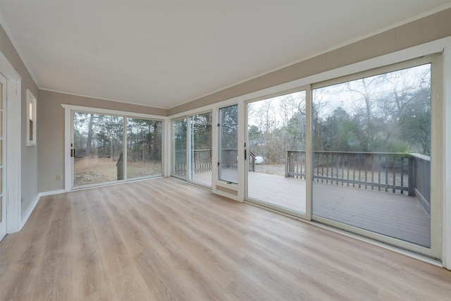 unfurnished sunroom featuring a healthy amount of sunlight