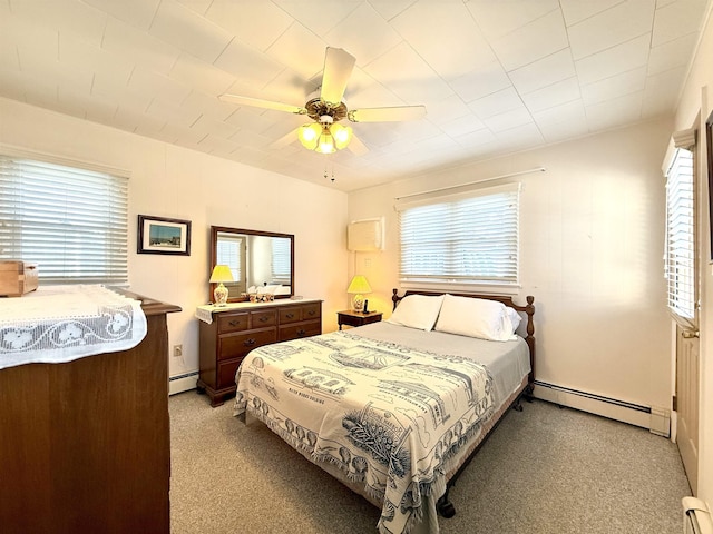 bedroom with ceiling fan, a baseboard radiator, and light carpet