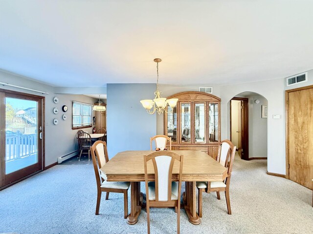 dining room with carpet flooring, an inviting chandelier, and a baseboard radiator