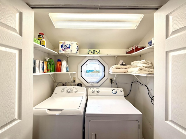 washroom featuring washer and clothes dryer